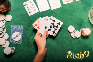 Playing cards and casino chips with a winning combination on top of a poker table