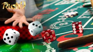 craps table with 2 kinds of dice that are being used in a casino